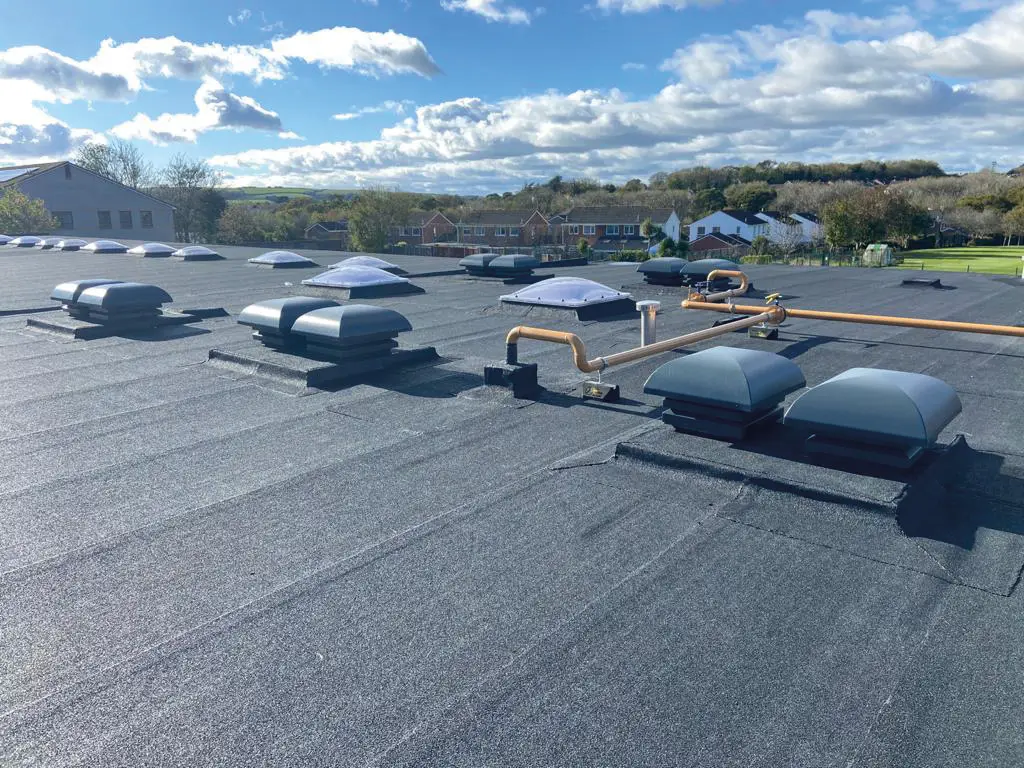 Photo of the Torpoint Community College roof after the IKO ULTRA Prevent 25 roofing system installation