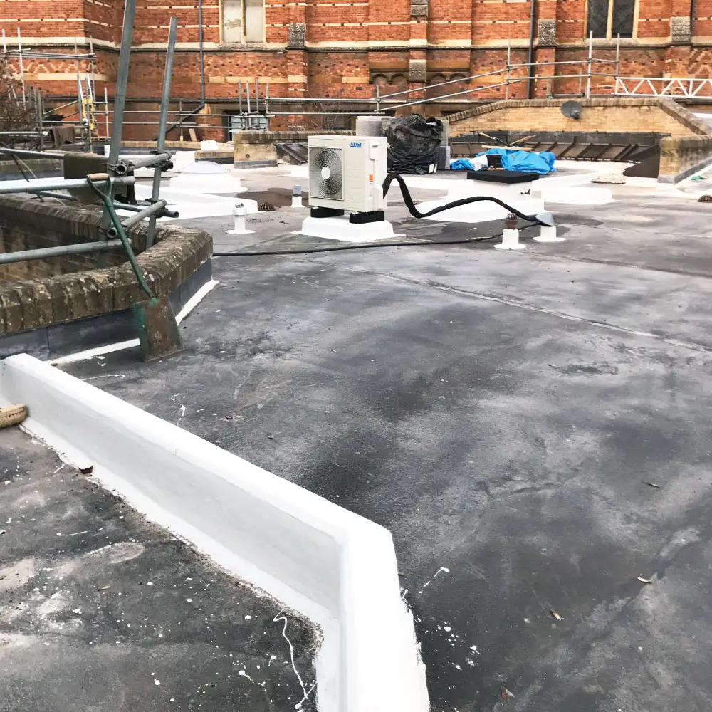 Photo of the IKO Permaphalt roofing system being installed at Keble College