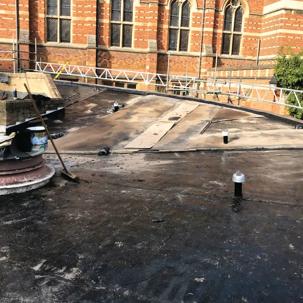 Photo of the IKO Permaphalt roofing system being installed at Keble College