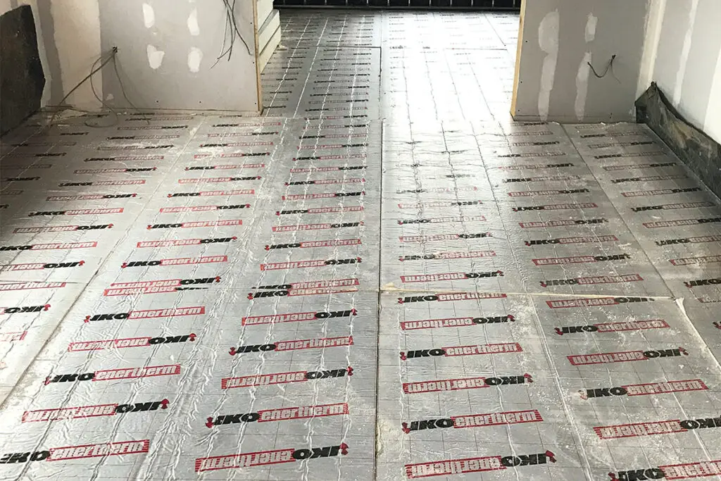 A photo of IKO enertherm insulation boards being used for an offsite construction project floor