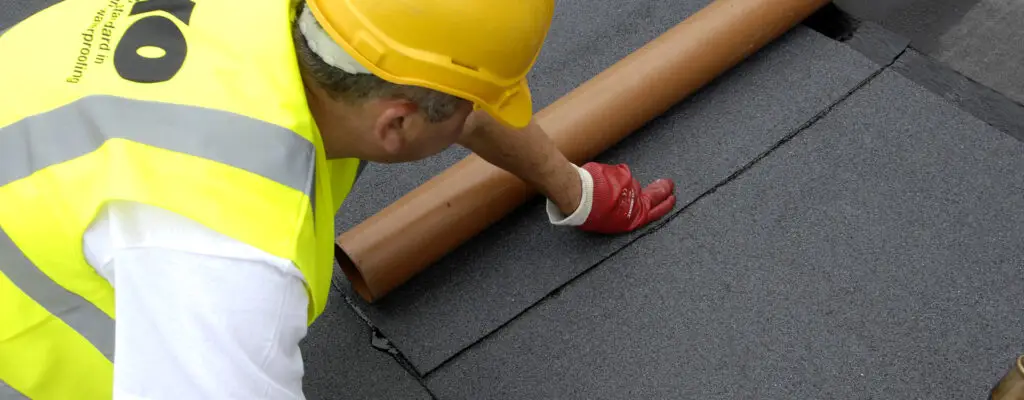 Photo of an approved installing contractor providing roof maintenance of IKO roofing systems