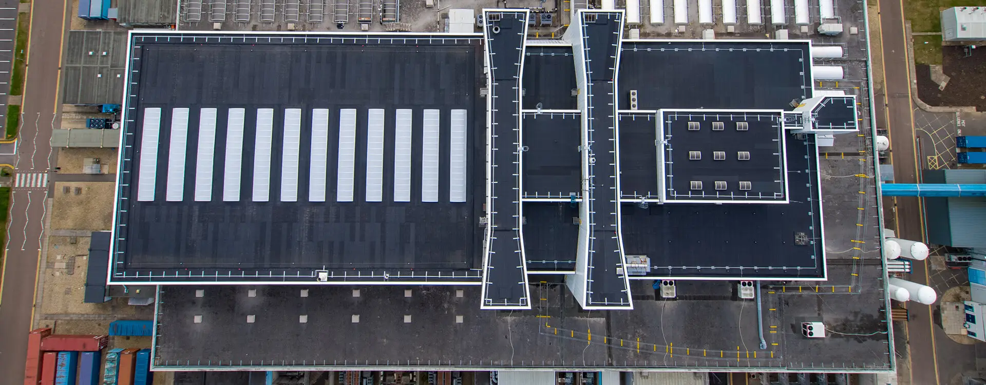 Bird’s-eye view photograph of a finished IKO reinforced bituminous membrane system complete with flat roof construction essentials