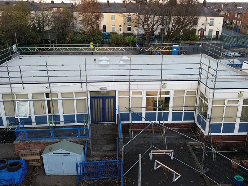 Aerial photograph of an IKO metatech cold applied liquid system being installed at Mossfield Primary School in Manchester