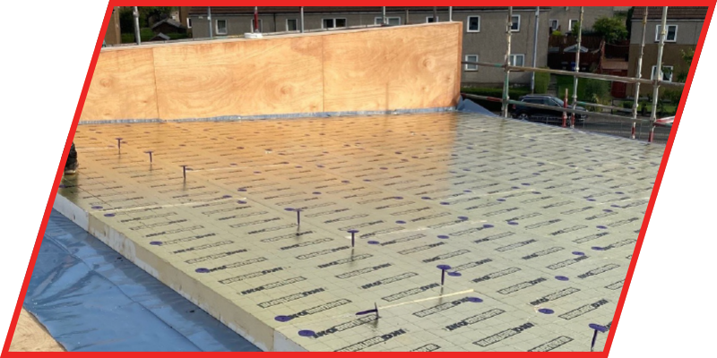 Photo of IKO enertherm GOLD insulation boards being installed as part of a roofing system