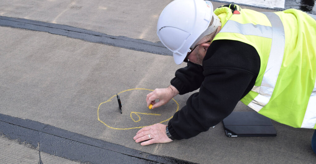 Partnering with IKO for sustainability and ESG blog - photo of an installing contractor on site