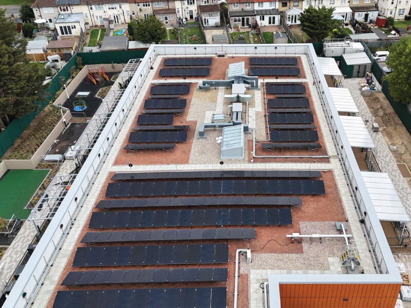 Photo of the IKO Permatec LI hot melt inverted roofing system, IKO Armourplan PSG single ply roofing system, and IKO Elements Extensive Green Roof at the Oxlow Bridge SEND School project