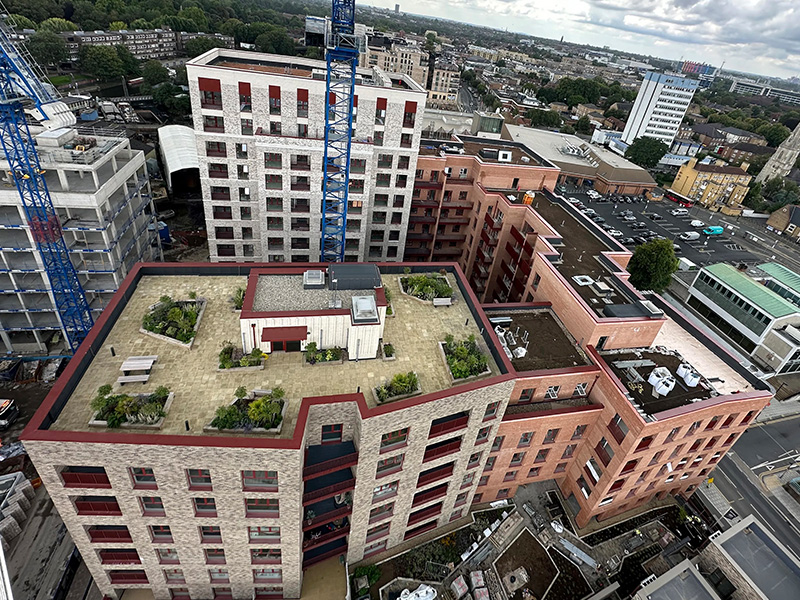 Mixed-use housing development in Brentford with blue roof, green roof and inverted roof waterproofing systems